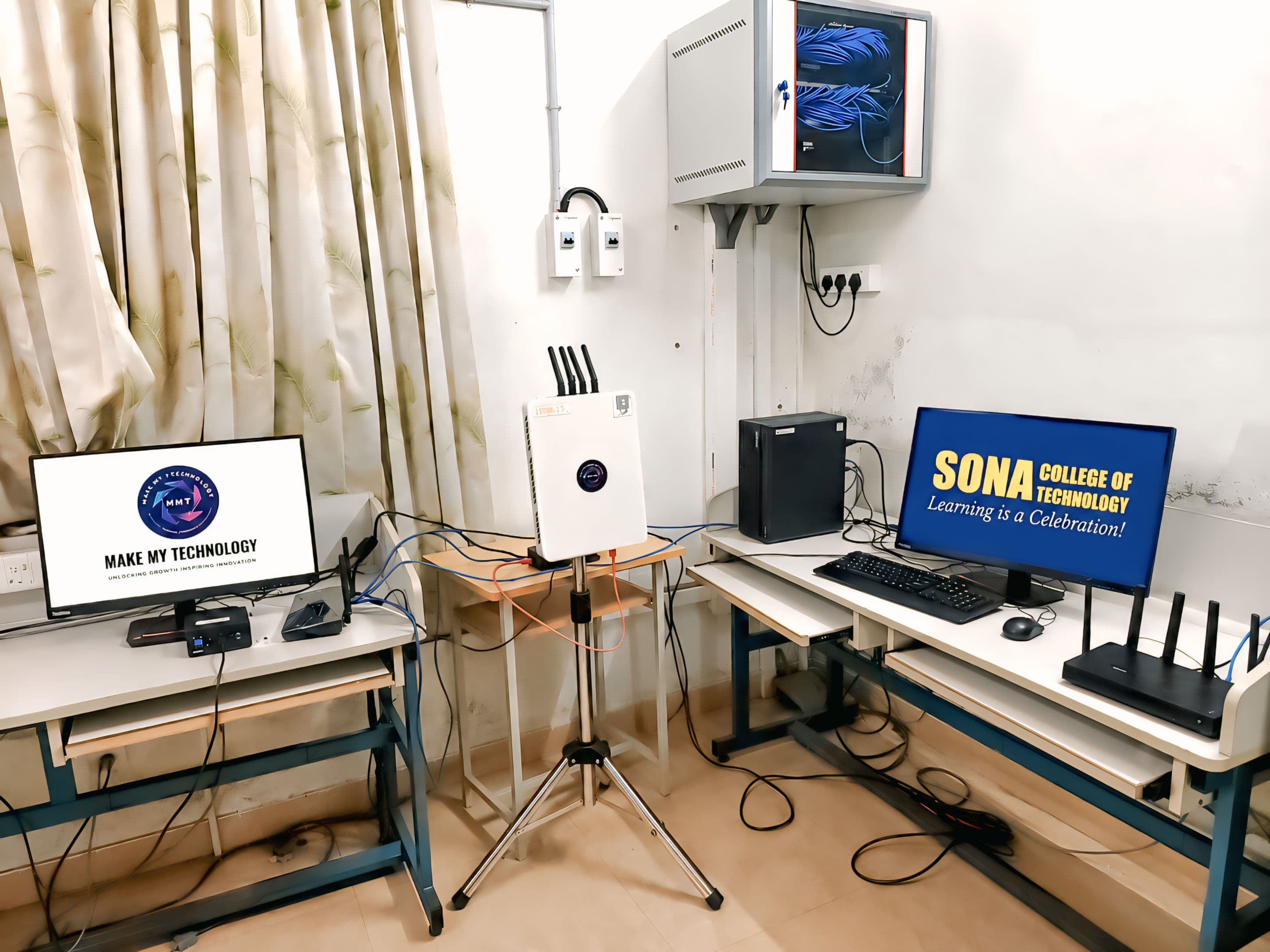 MMT 5G/6G Studio deployed at Sona College of Technology — a tripod-mounted MMT unit between MMT and Sona-branded monitors with a server rack.
